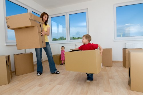Careful wrapping and labelling of household items for relocation