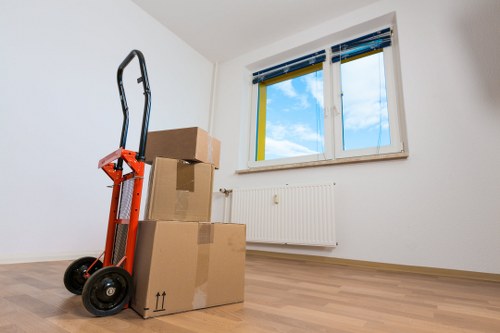 Packed office boxes and furniture ready for a commercial relocation
